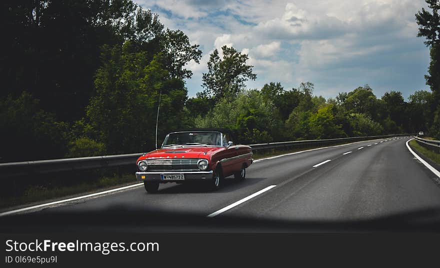 Photography of Red Car on Road