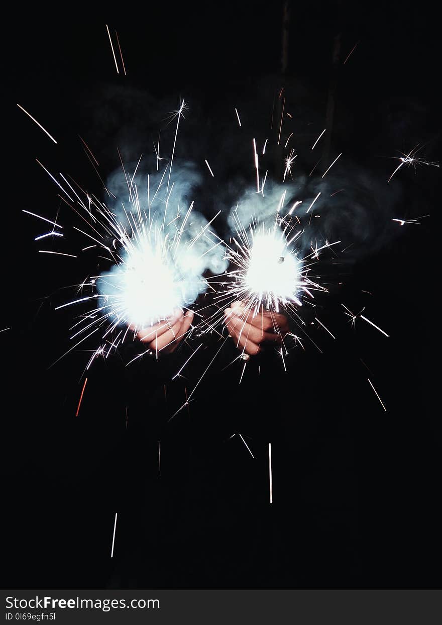 Photo of Person Holding Sparklers