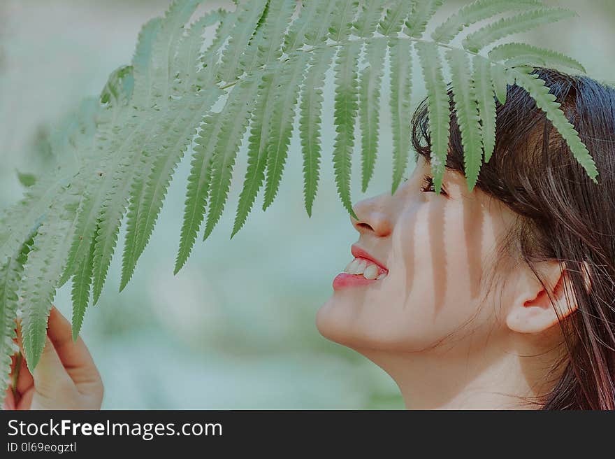 Woman Holding Leaves