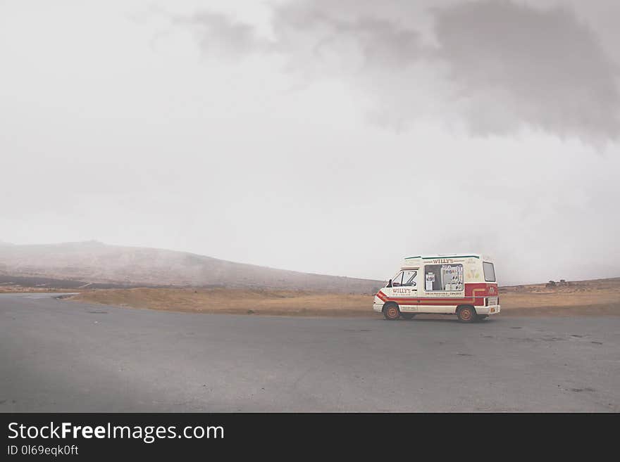 White Vehicle in the Middle of the Road