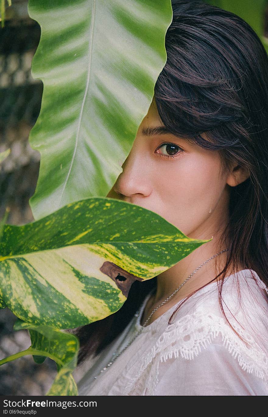 Closeup Photo of Woman Wearing White Crew-neck Top