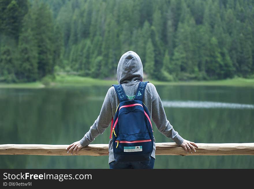 Person Wearing Gray Hoodie Jacket Watching Lake