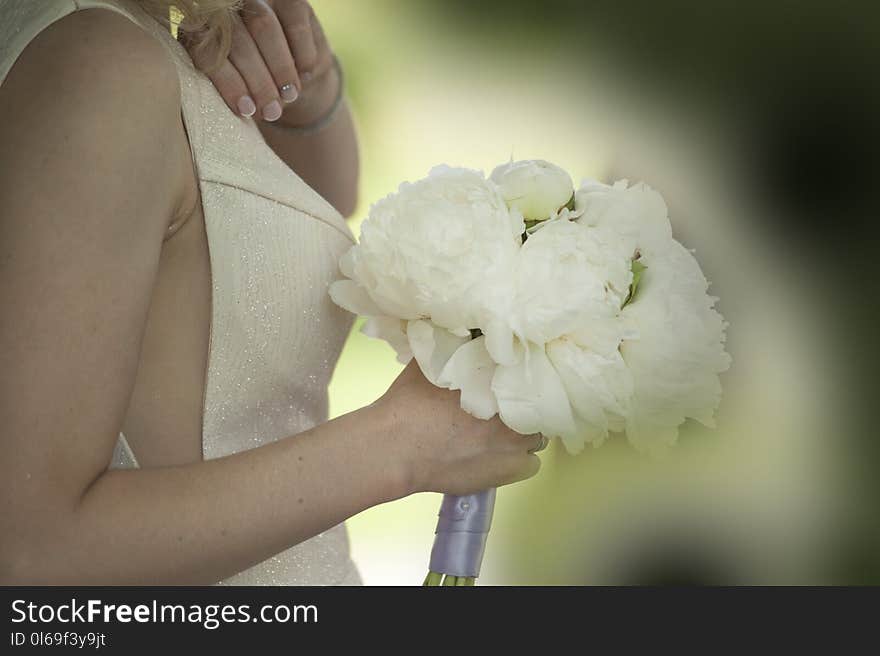 Woman Holding White Flower Bouquet