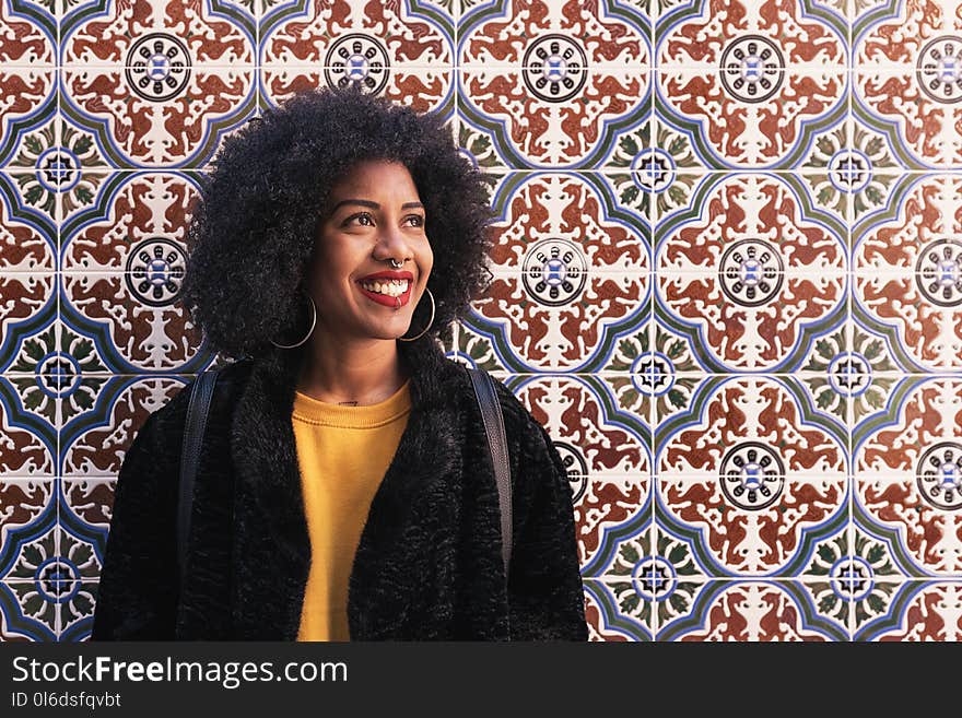 Portrait of beautiful afro american woman in the street. Portrait of beautiful afro american woman in the street.