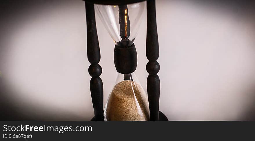 Hourglass on dark background.the concept of time