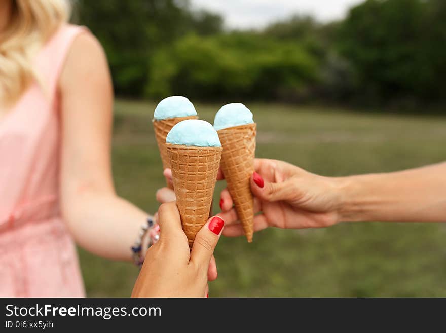 Girl hold icecream cone in hand