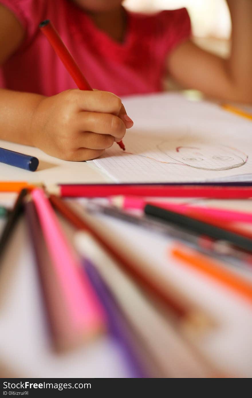 Little girl drawing at home. Focus is on hands. Colorful image. Little girl drawing at home. Focus is on hands. Colorful image.