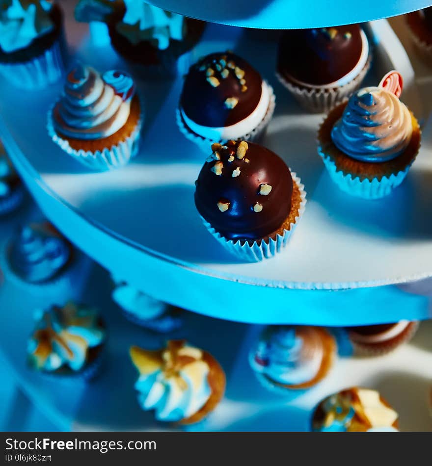 Selection of decorative desserts on buffet table at catered event