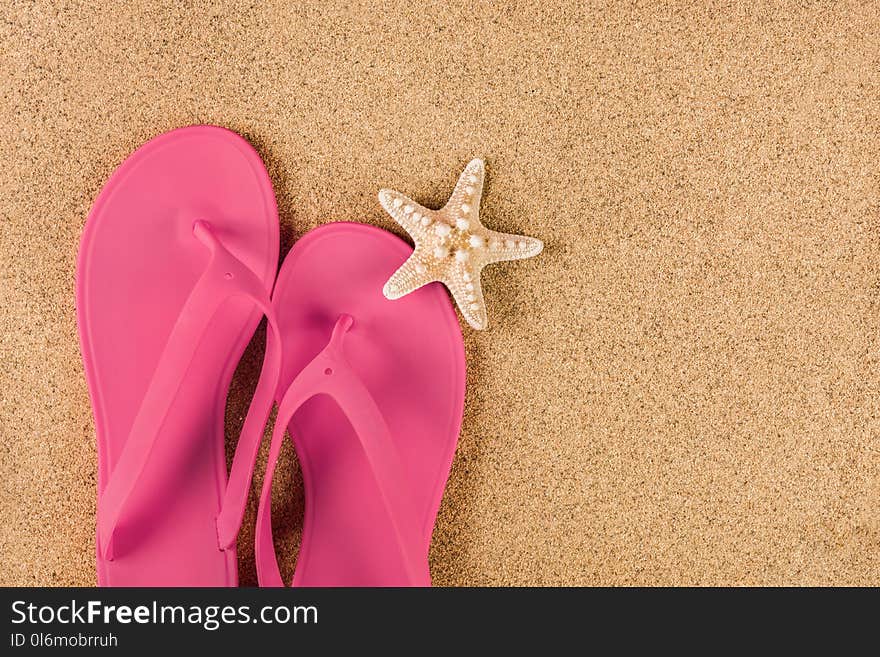 This captivating close-up image showcases a top view of a feminine pink sandal flip flop resting on a sandy beach, adorned with a beautiful starfish. The vibrant pink color of the sandal adds a touch of playfulness and femininity to the composition, while the starfish adds a natural element that represents the summer beach vibes. The sandy beach background creates a sense of relaxation and vacation. With ample copy space, this image is perfect for conveying a summer vacation concept and can be used to promote travel destinations, beach accessories, or summer-related content. Whether for advertising campaigns, social media posts, or editorial purposes, this visually appealing image will capture attention and evoke a sense of fun and relaxation associated with summer vacations. This captivating close-up image showcases a top view of a feminine pink sandal flip flop resting on a sandy beach, adorned with a beautiful starfish. The vibrant pink color of the sandal adds a touch of playfulness and femininity to the composition, while the starfish adds a natural element that represents the summer beach vibes. The sandy beach background creates a sense of relaxation and vacation. With ample copy space, this image is perfect for conveying a summer vacation concept and can be used to promote travel destinations, beach accessories, or summer-related content. Whether for advertising campaigns, social media posts, or editorial purposes, this visually appealing image will capture attention and evoke a sense of fun and relaxation associated with summer vacations.