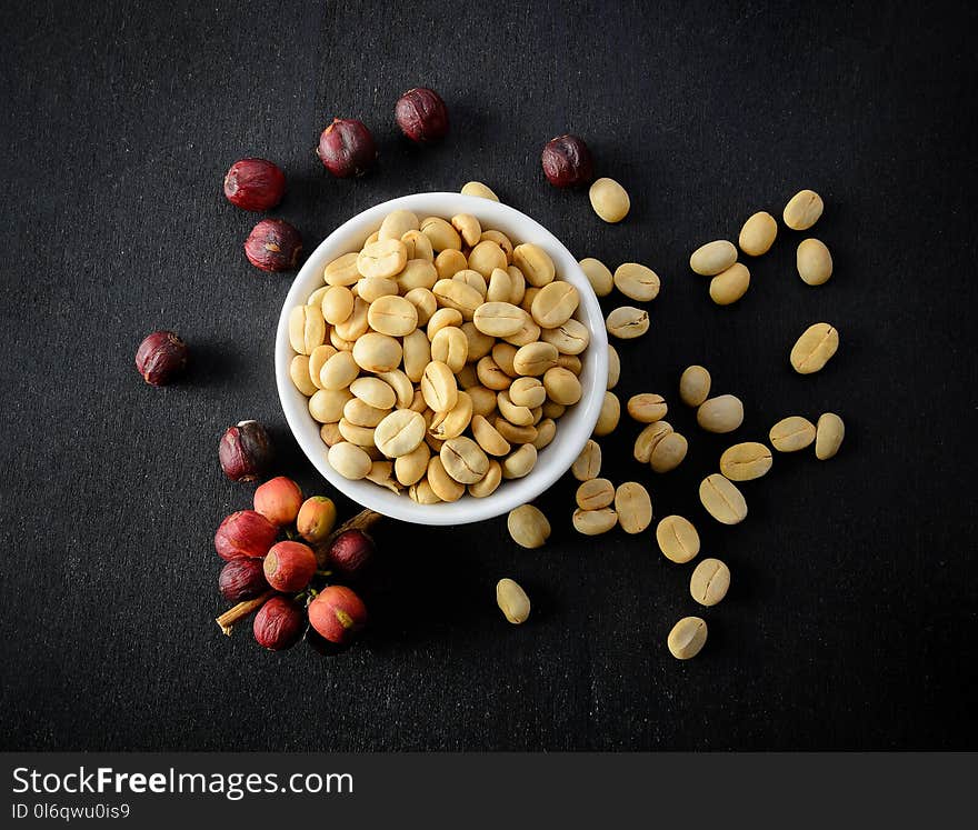 Coffee Seeds On Black Wooden Background