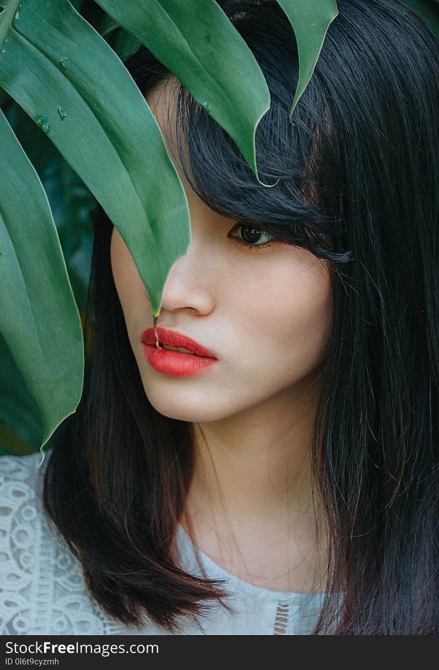 Photo of Woman Near Plant