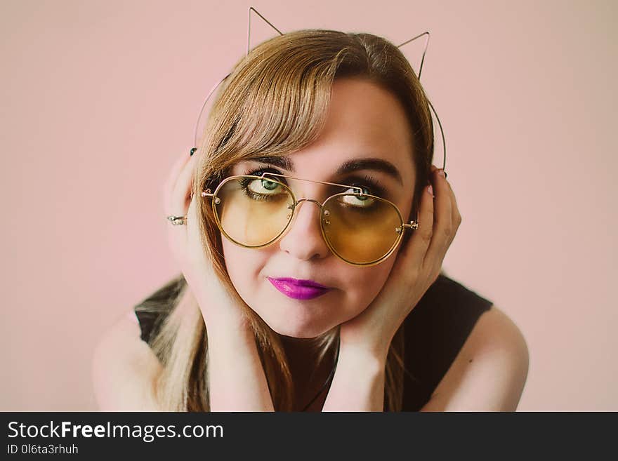 Woman Wearing Sunglasses and Alice Band