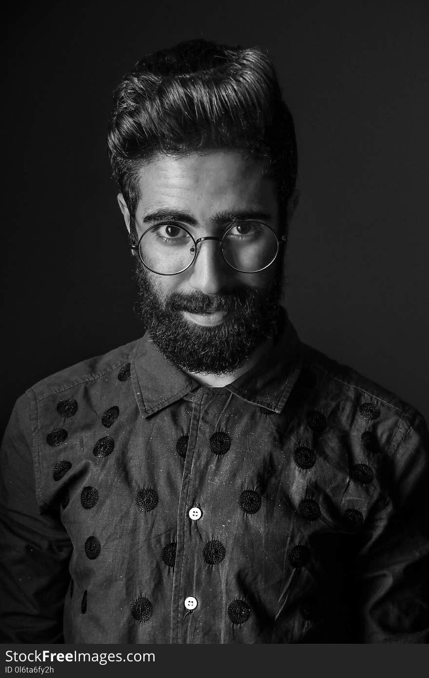 Grayscale Photography of Man Wearing Eyeglasses