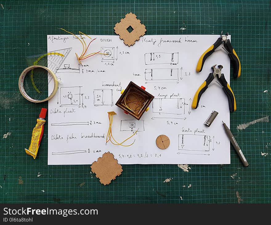 White Diagram Paper Under Pliers