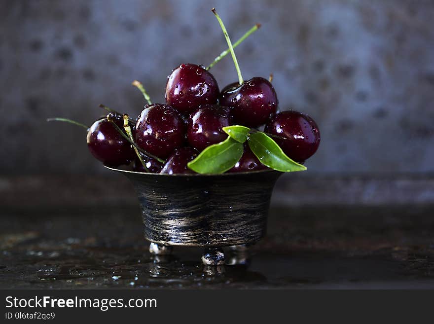 Red Cherries on Stainless Steel Bowl