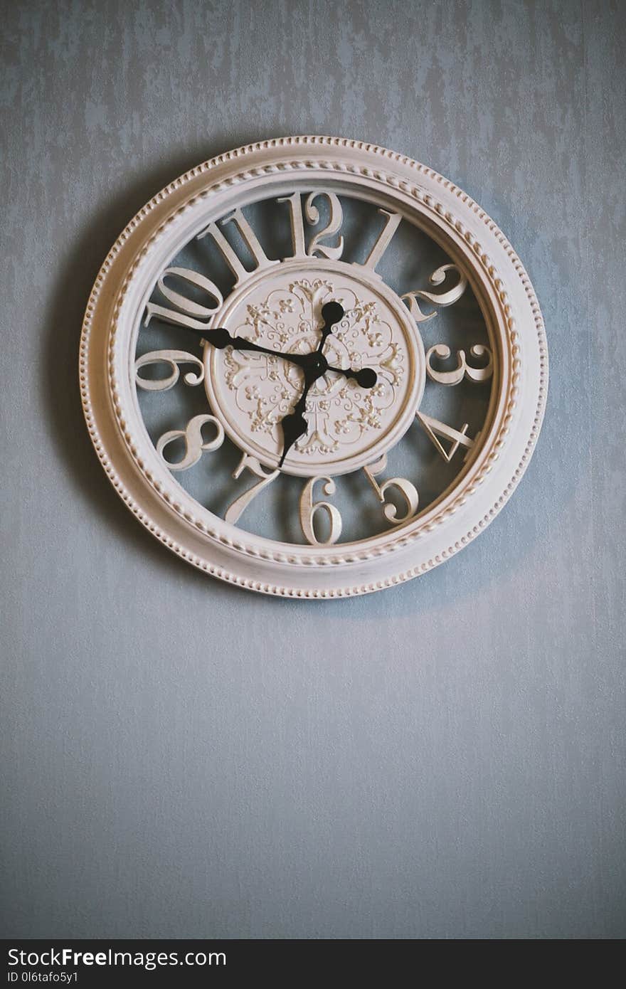 Round White Analog Clock Showing Time