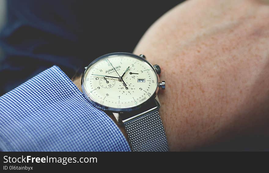 Person Wearing Silver-colored Analog Watch