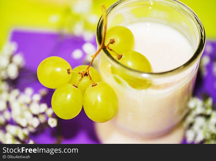 Green grapes and buttermilk in glass.