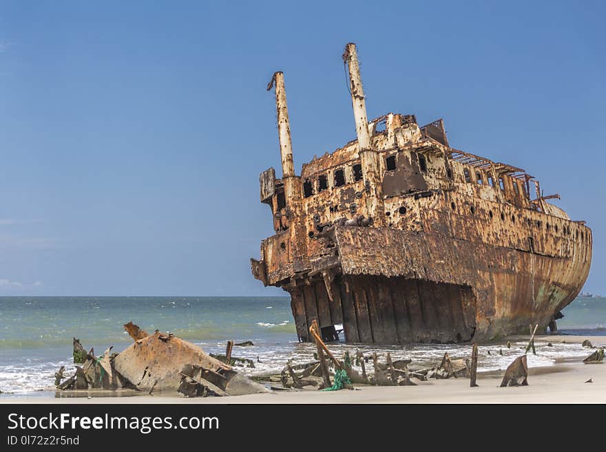 Ships cemetery - abandoned ship carcass in the atlantic ocean, Angola, Africa. Ships cemetery - abandoned ship carcass in the atlantic ocean, Angola, Africa