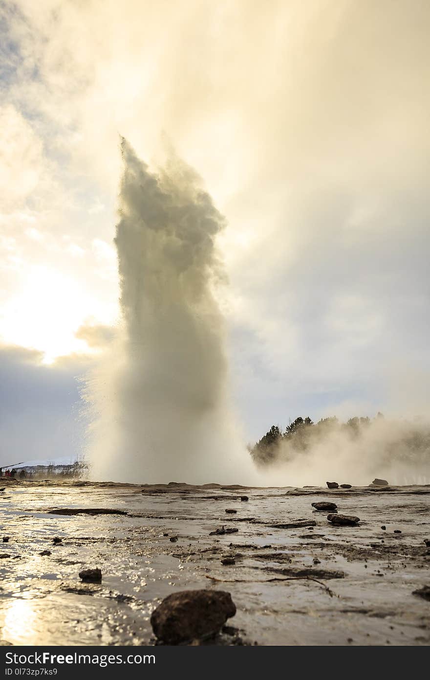 Geyser fountain discharges water at Strokkur Geysir, Iceland located at the golden circle route. A popular landmark for tourists to visit.