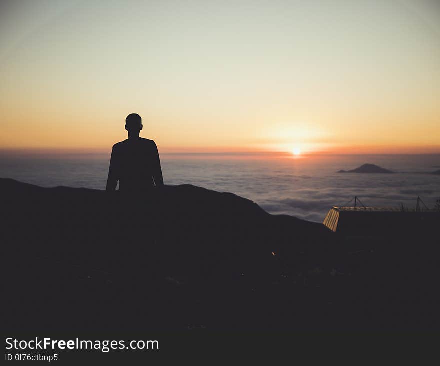 Silhouette of Person during Dawn