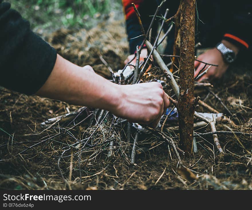 Two People Making fire