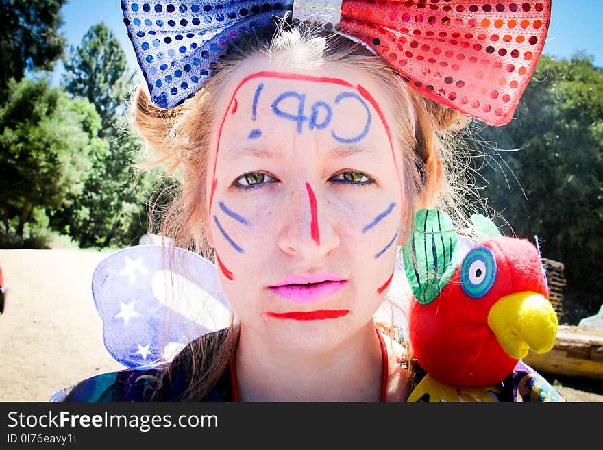 Woman Wearing Red and Blue Bowtie