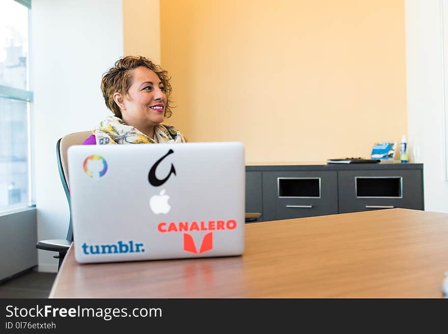 Woman Sitting Near Silver Apple Macbook