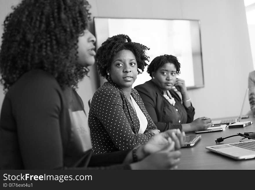 Woman Discussing With Her Colleagues