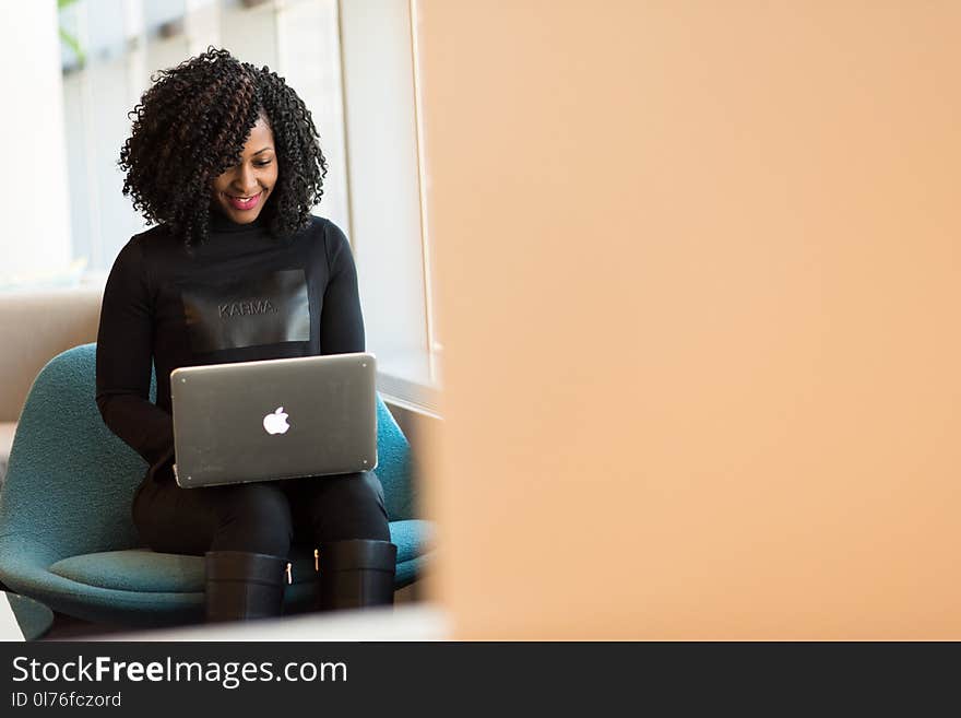 Woman Holding Macbook