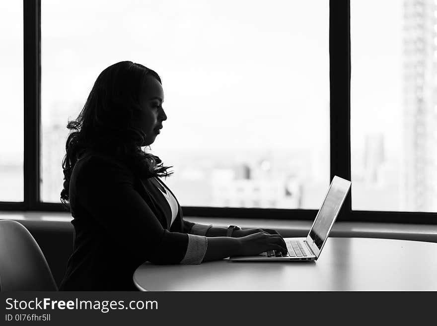 Grayscale Photography of Woman Using Laptop