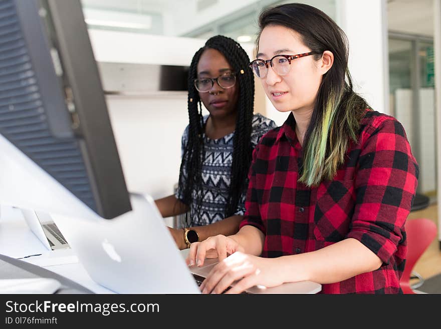 Woman Wearing Red and Black Checkered Blouse Using Macbook