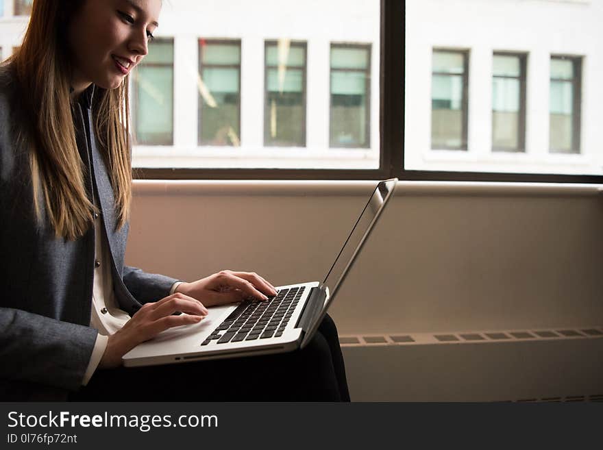 Photography of Woman Using Laptop