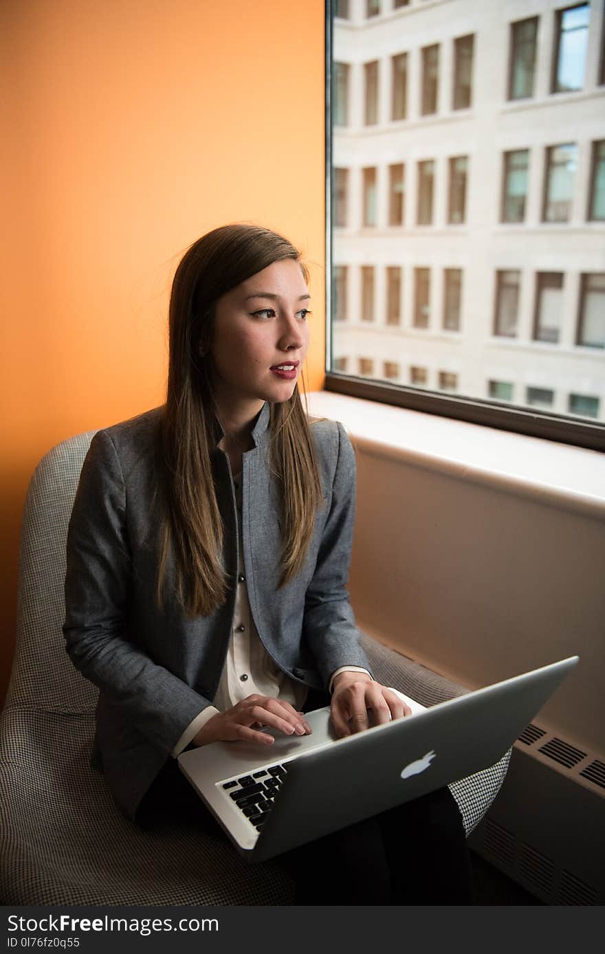 Photography of Woman Using Laptop