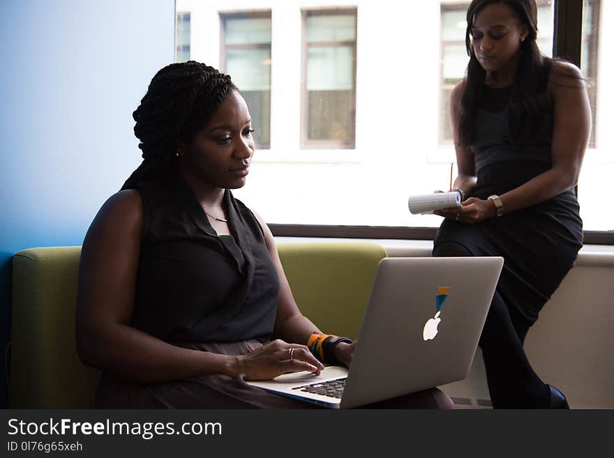 Woman Wearing Black Blouse Holding White Laptop