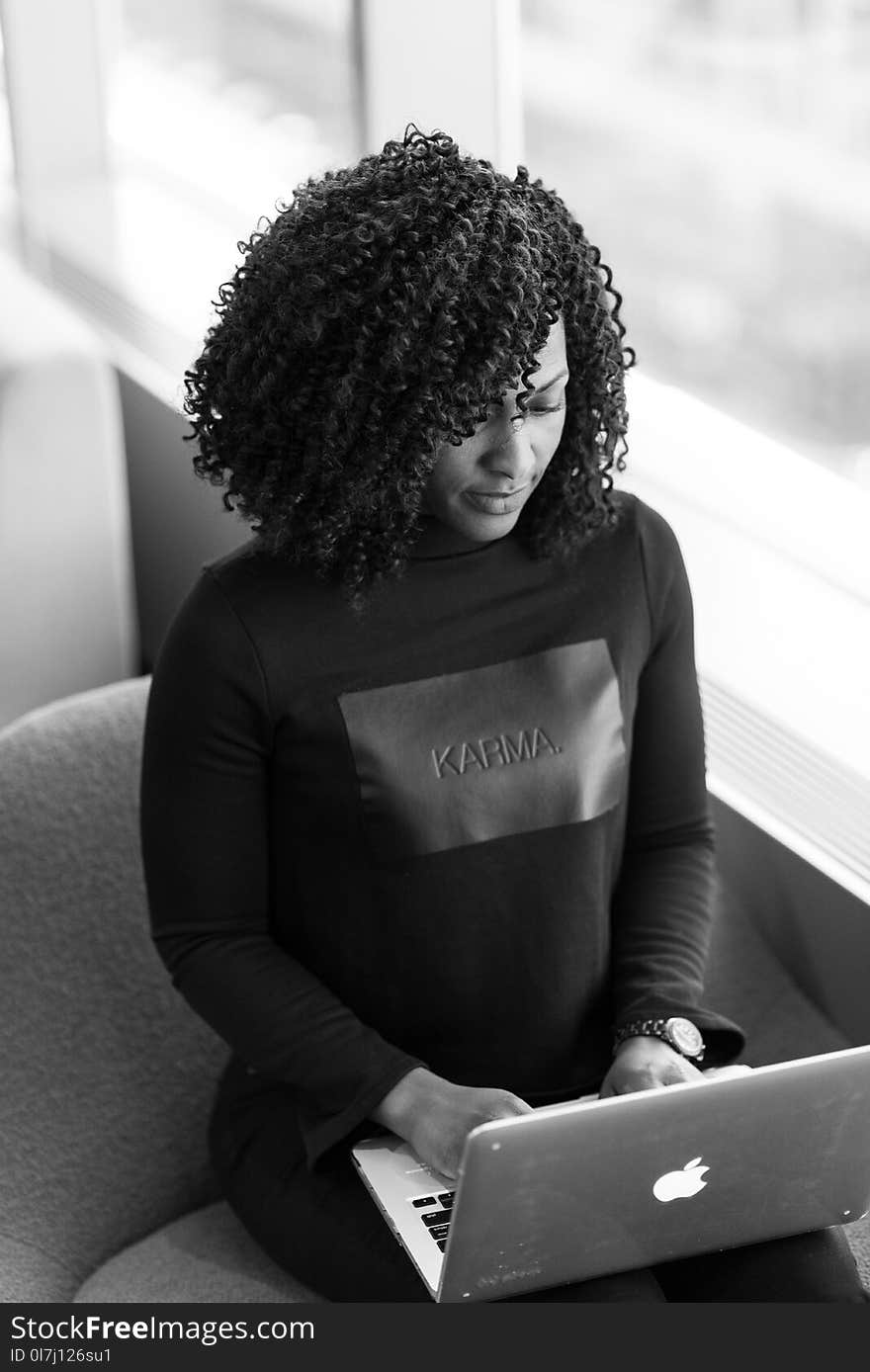 Monochrome Photography of Woman Using Laptop