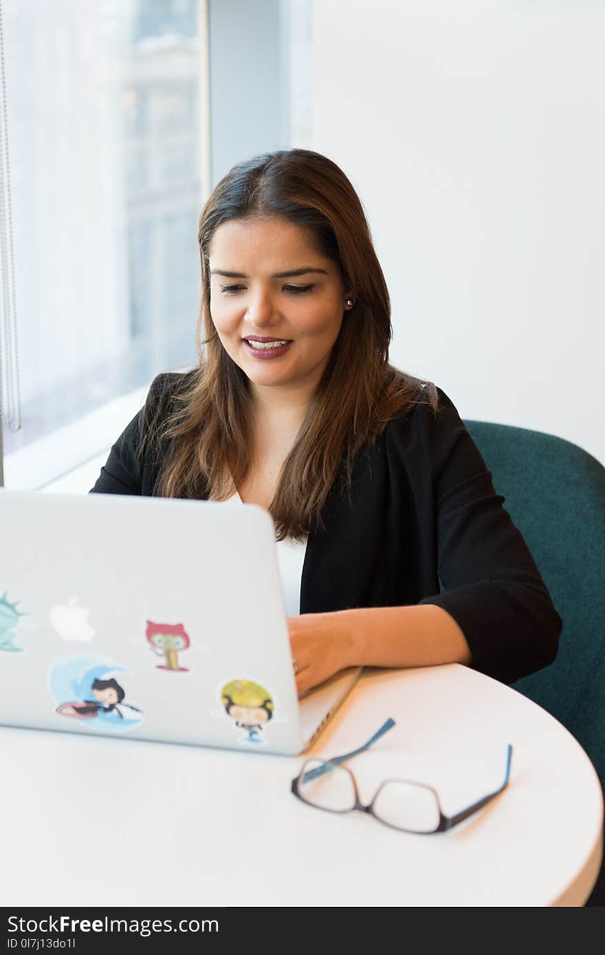 Photography of a Woman Using Laptop