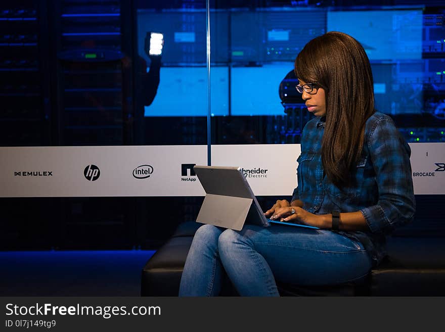 Photography of Woman Using Ipad