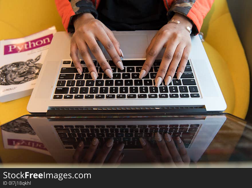 Person Typing On Macbook Pro