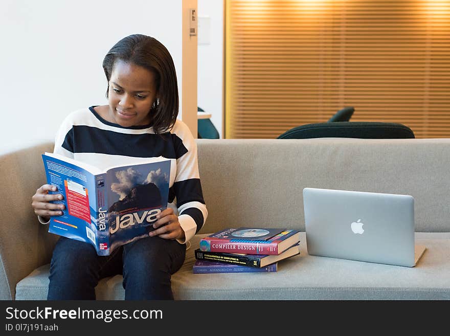 Photography of Woman Reading Book