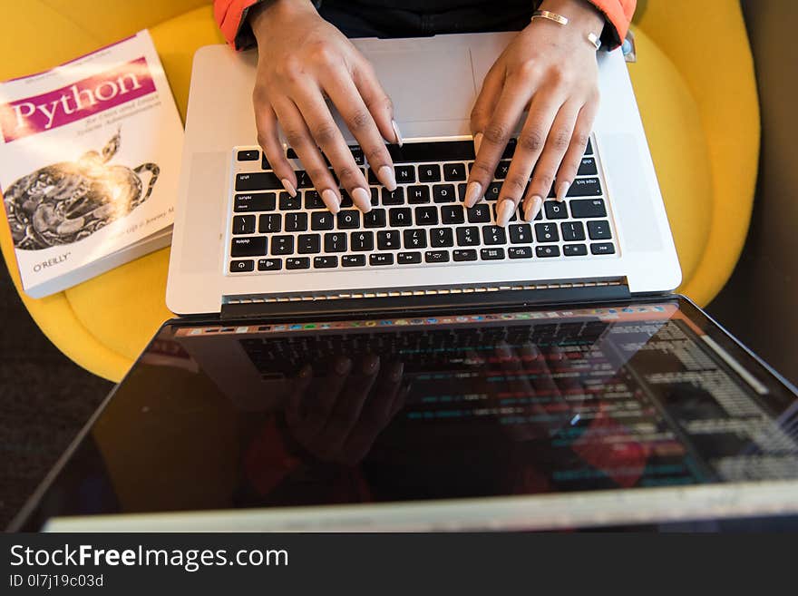 Woman Typing On Macbook Pro