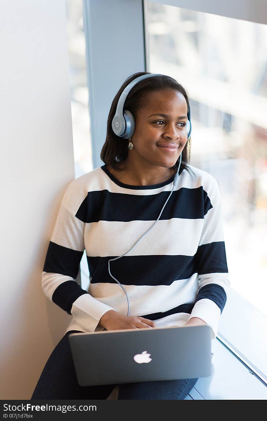 Photography of Woman Listening to Music