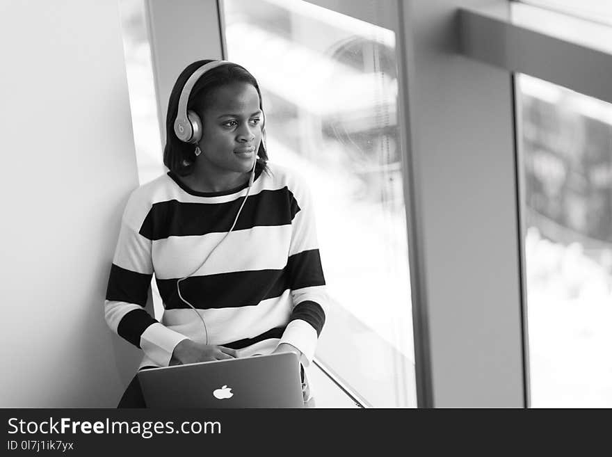 Photography of Woman Listening to Music