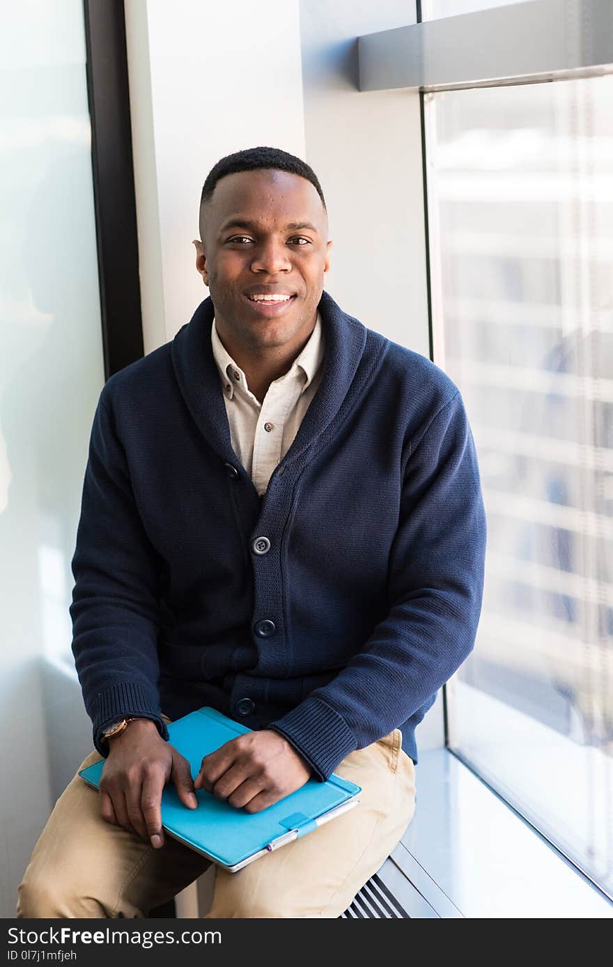 Man Wearing Blue Button-up Sweater