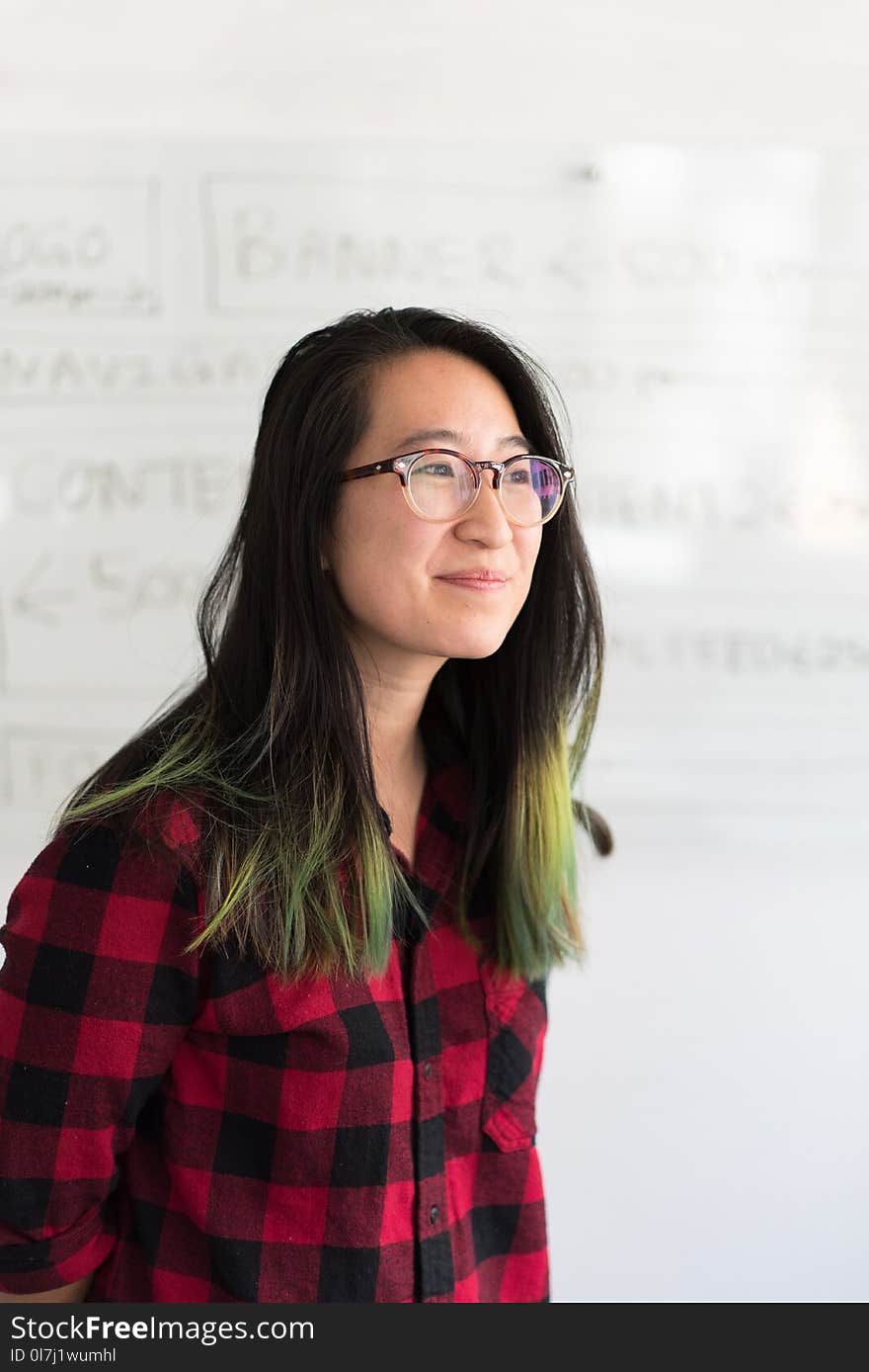 Shallow Focus Photography of a Woman in Red and Black Checkered Dress Shirt