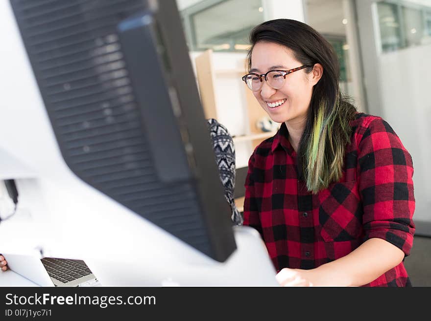 Woman Facing Computer Monitor