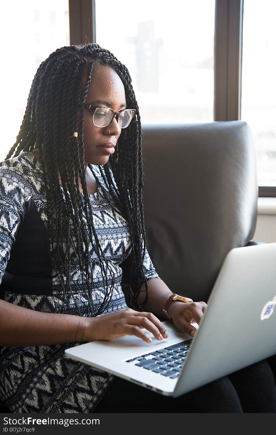 Woman Sitting Holding Silver Macbook