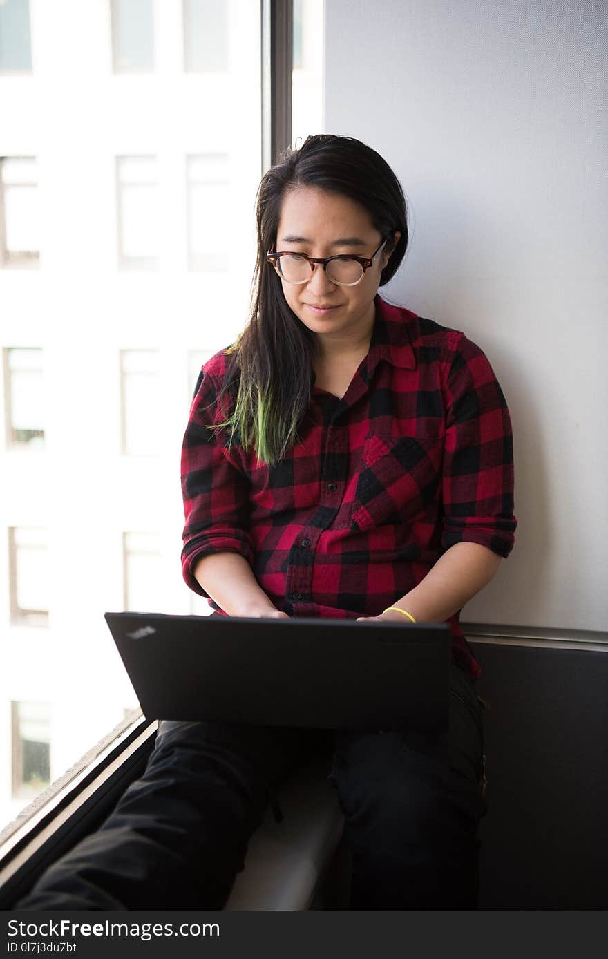 Black Laptop Computer on Woman&#x27;s Lap