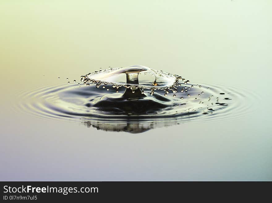 Abstract background of splash of water with paints, a crown of liquid, collision of drops, the concept art. Abstract background of splash of water with paints, a crown of liquid, collision of drops, the concept art