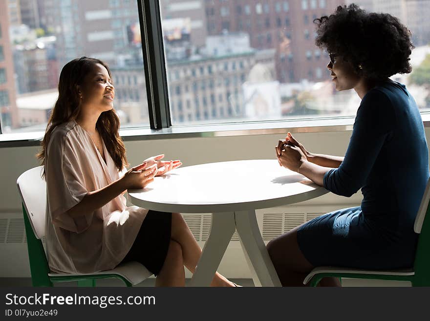 Photography of Women Talking to Each Other